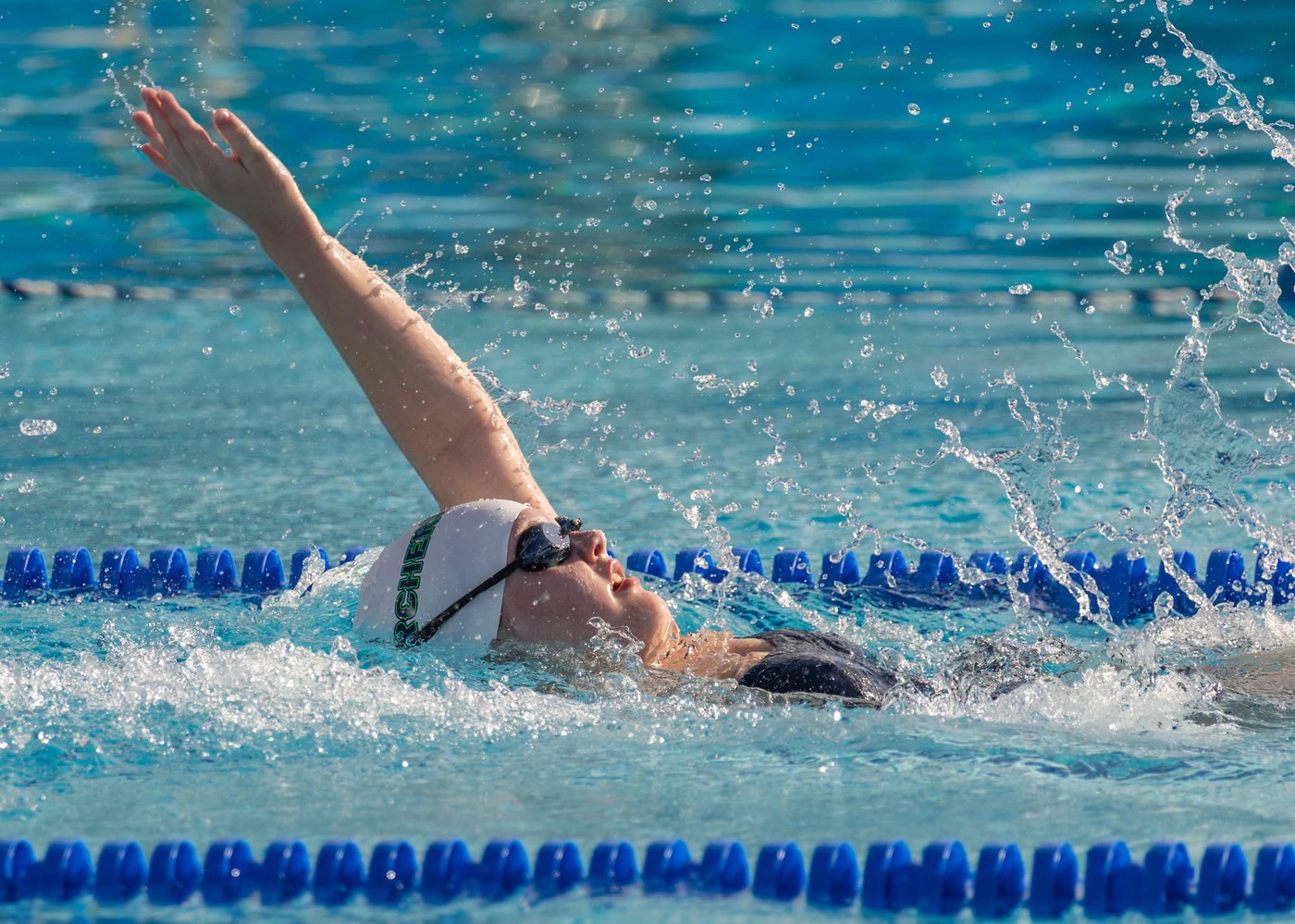 Person swimming - <p>Photos from our recent swim meet with Cypress Creek High School.</p>