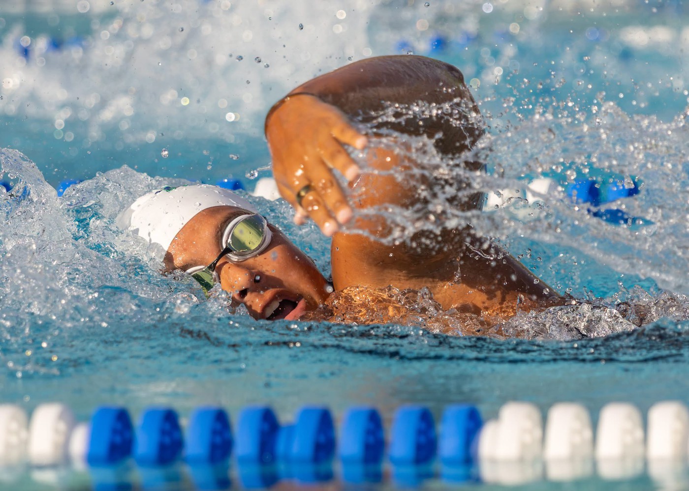 Person swimming - <p>Photos from our recent swim meet with Cypress Creek High School.</p>