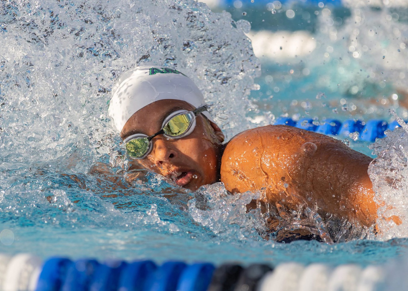 Person swimming - <p>Photos from our recent swim meet with Cypress Creek High School.</p>