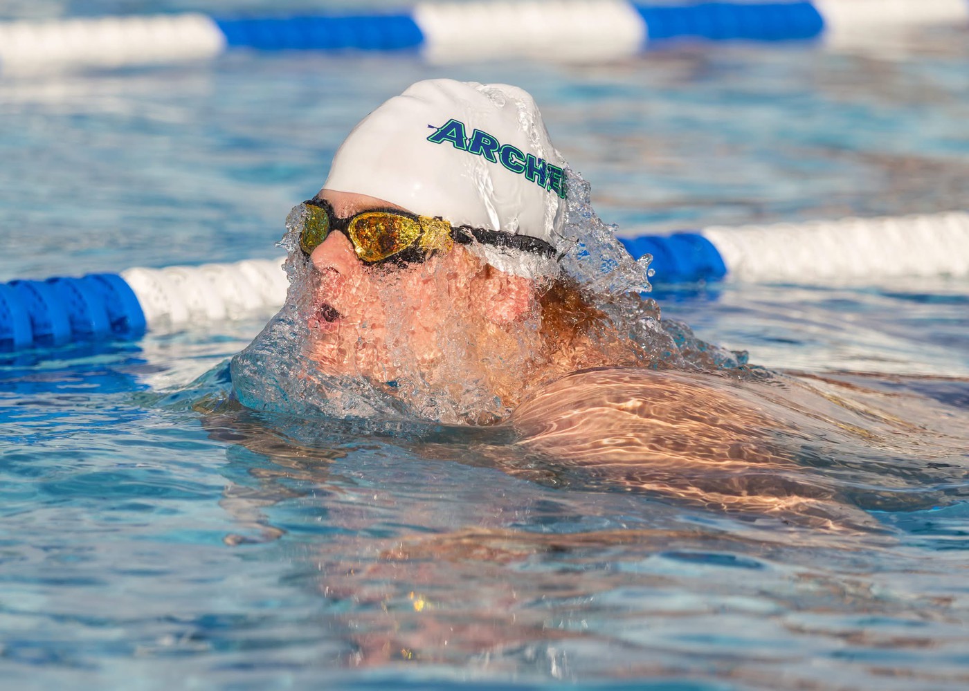 Person swimming - <p>Photos from our recent swim meet with Cypress Creek High School.</p>