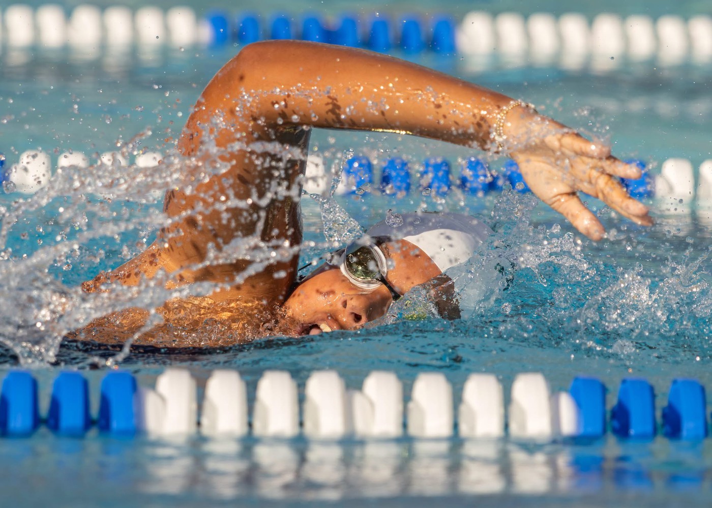 Person swimming - <p>Photos from our recent swim meet with Cypress Creek High School.</p>