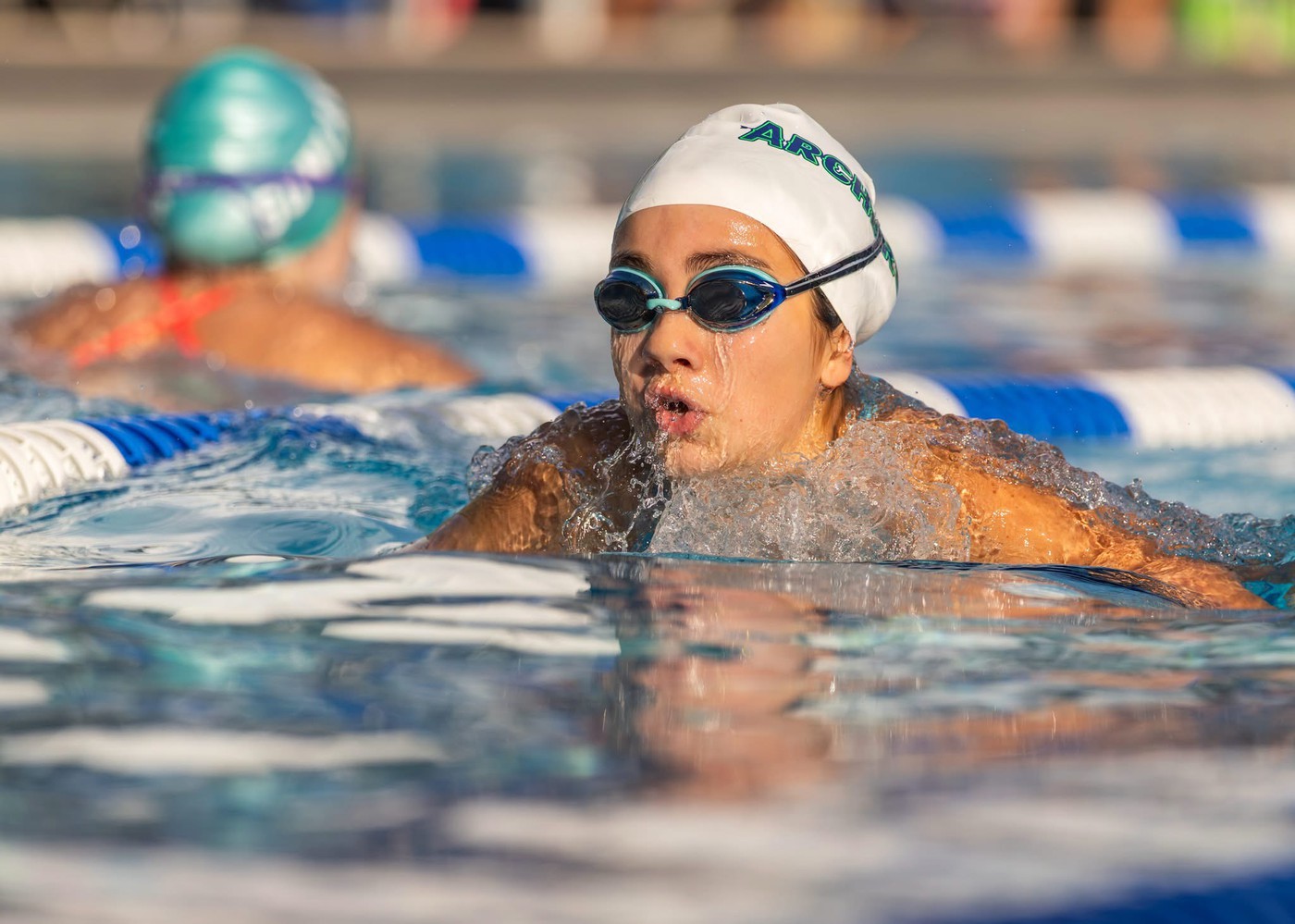 Person swimming - <p>Photos from our recent swim meet with Cypress Creek High School.</p>