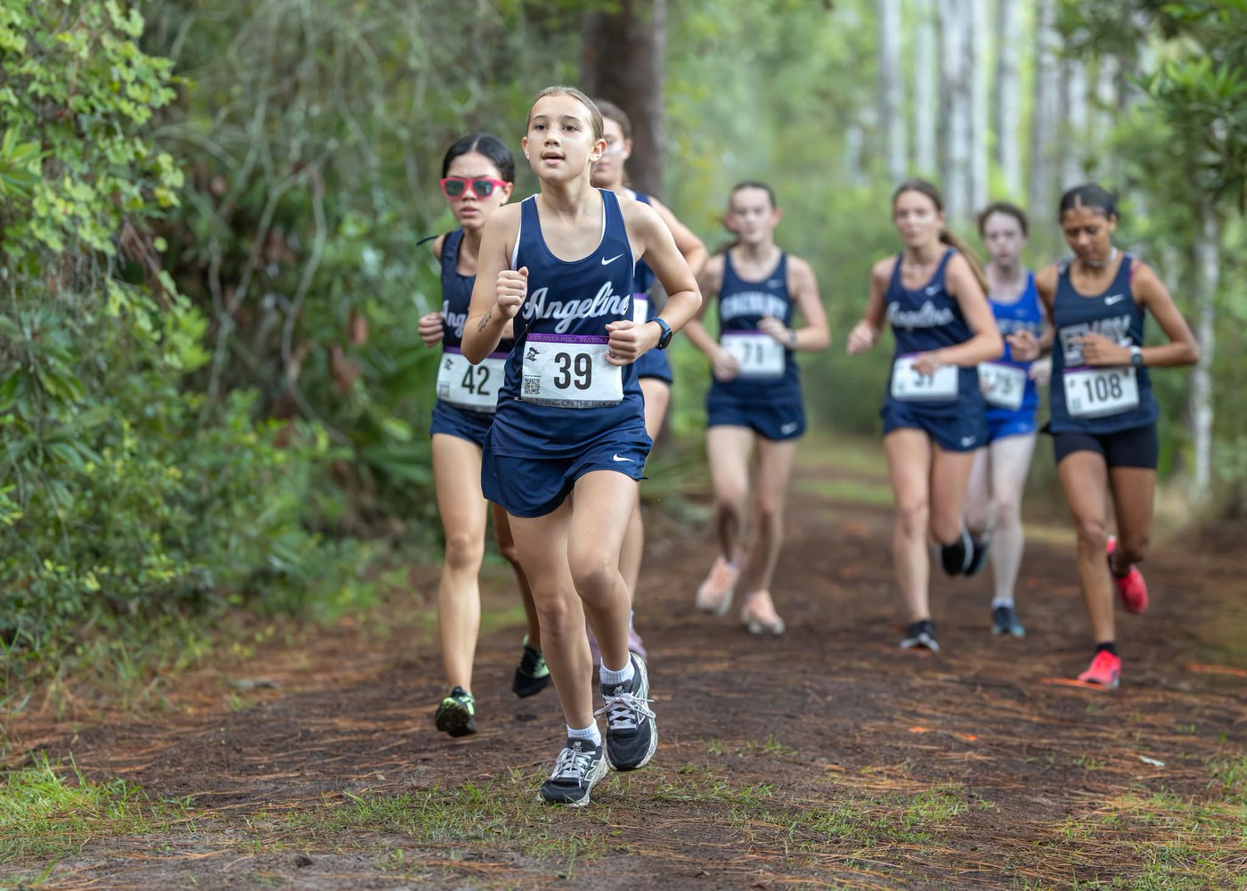 Students running. - <p>Photos from our recent cross country meet at River Ridge High School.</p>
