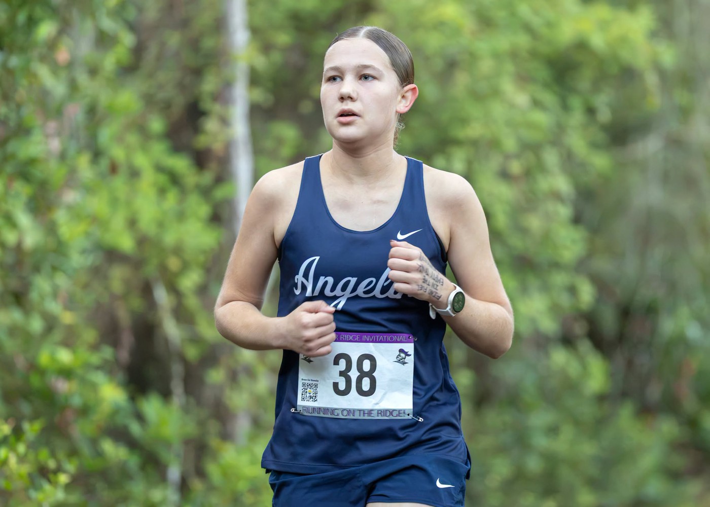 Student running. - <p>Photos from our recent cross country meet at River Ridge High School.</p>